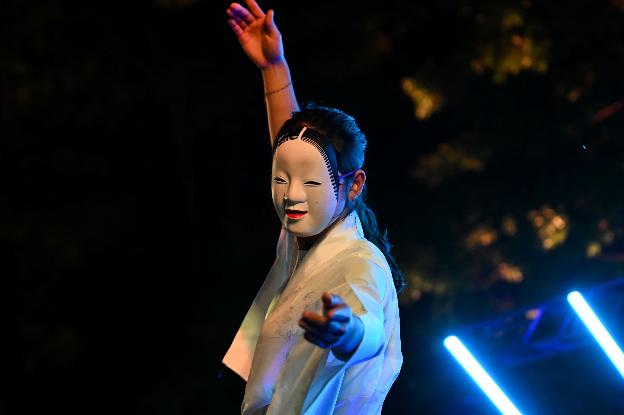Performer in traditional Japanese attire presents a cultural dance performance at the Canberra Nara Candle Festival.